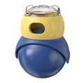 Yellow and blue owl-shaped plastic cat puzzle feeder with a food tumbler mechanism.