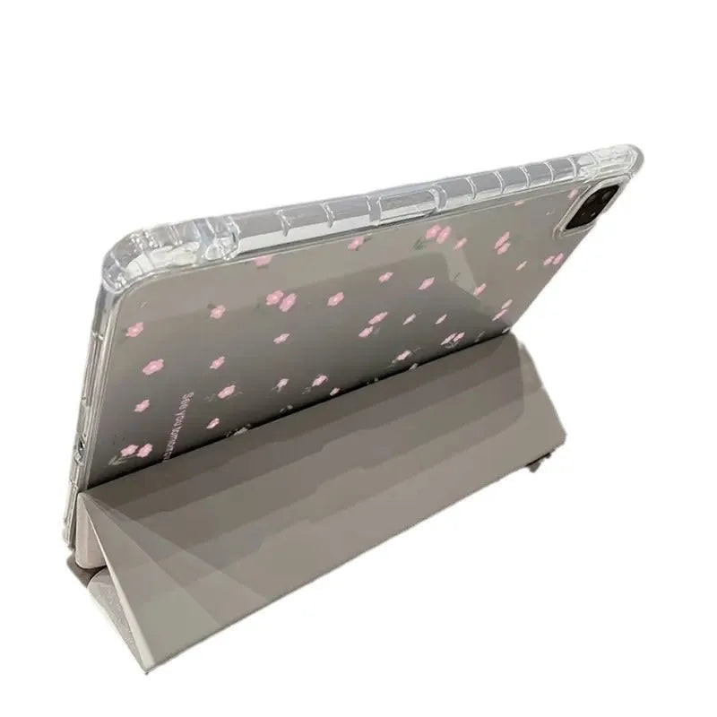 Transparent iPad case with floral cartoon pattern showing tri-fold stand position