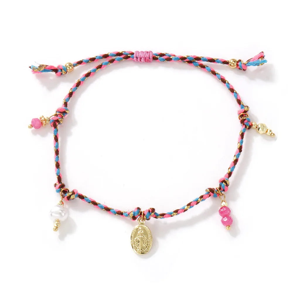 Hand-woven women's bracelet made from colourful braided rope with an integrated carrying strap tag design.