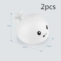 Automatic water-sensing whale bath toy with spray, lights, and music functions for baby bath time