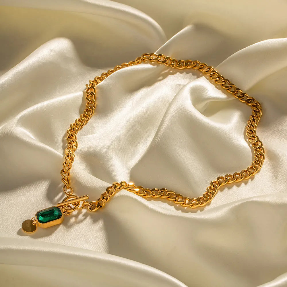 Gold electroplated titanium steel pendant necklace with French retro geometric design and emerald zircon accents