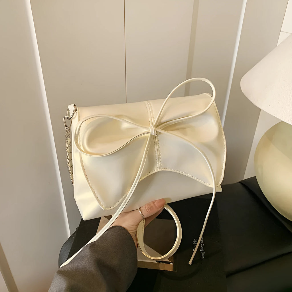 Women's underarm crossbody bag in horizontal square shape with sandwich pocket design and crossbody strap