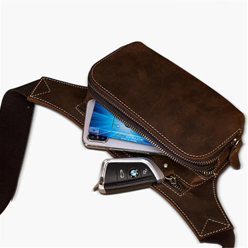 Brown cowhide leather men's sports waist bag with pull closure, shown with phone and laptop compartments.