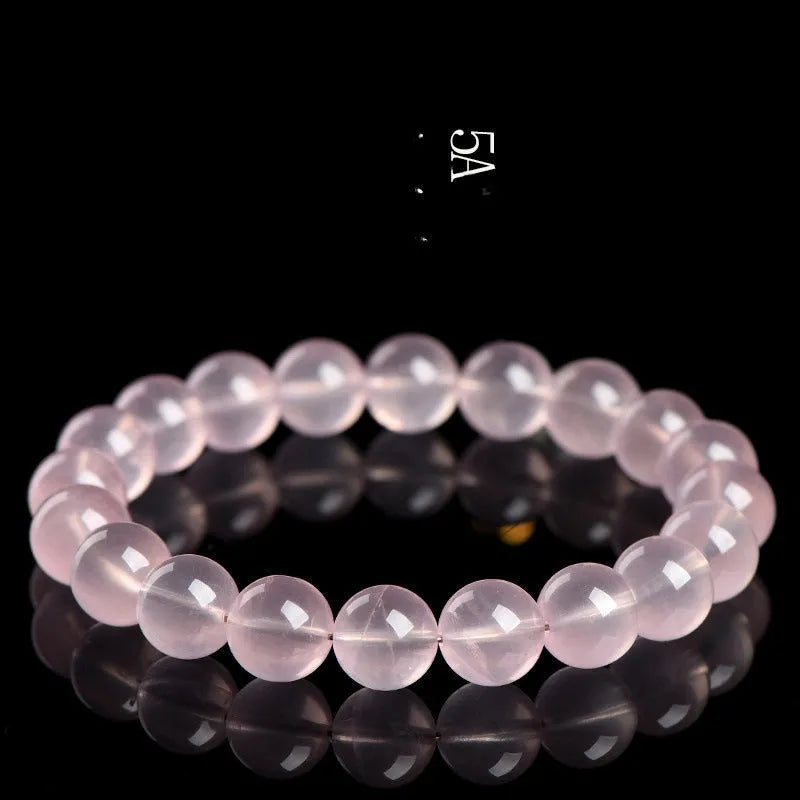 Women's natural starlight crystal round bead bracelet in pink, showing polished finish and single circle bead arrangement.