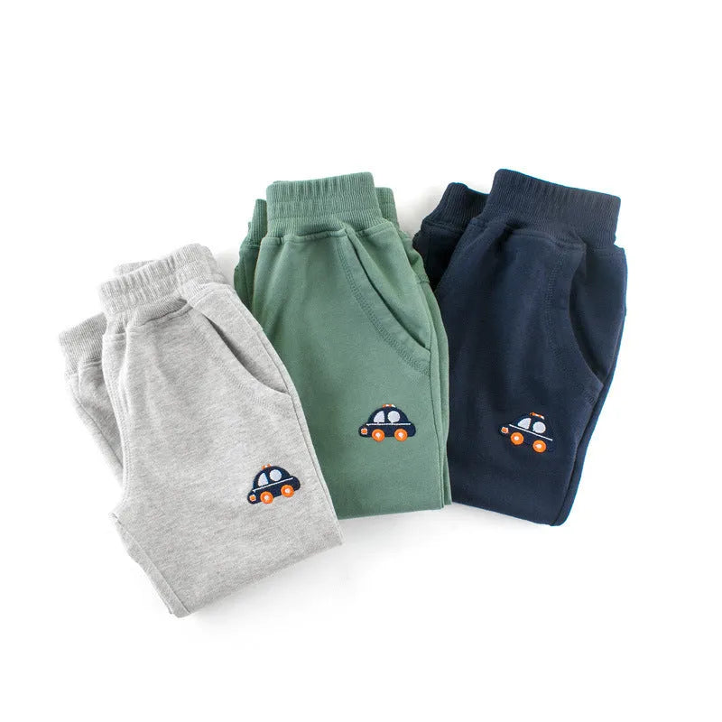 Boys Korean style sports sweatpants with cartoon pattern, soft treated fabric, available in blue green grey navy blue