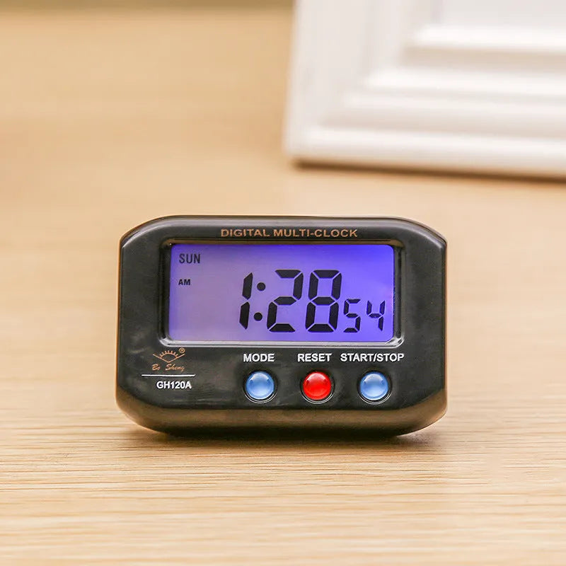 Portable LCD alarm clock with luminous display, showing time and date on screen