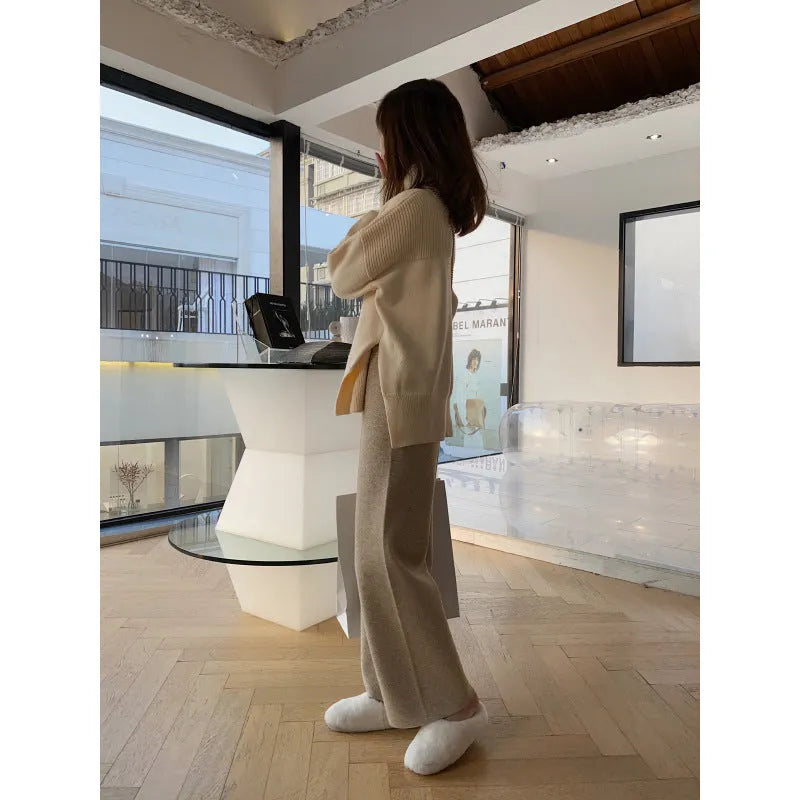 Women's high-waist knitted wide-leg trousers in a cream white colour, showcasing the straight-leg mopping style.