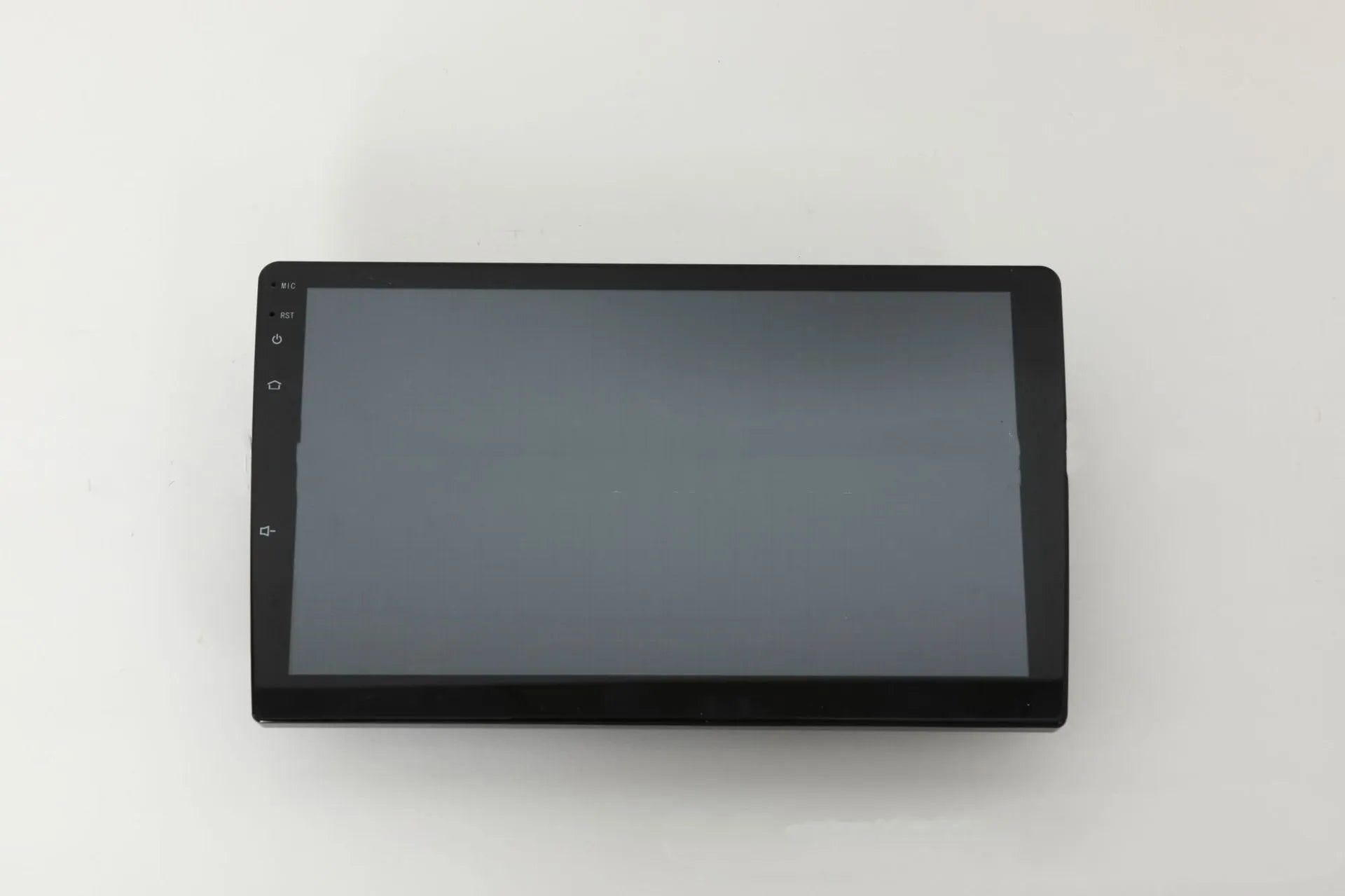 10.1 inch Android car head unit with touch screen, trapezoid panel design and universal fitting for vehicle dashboards