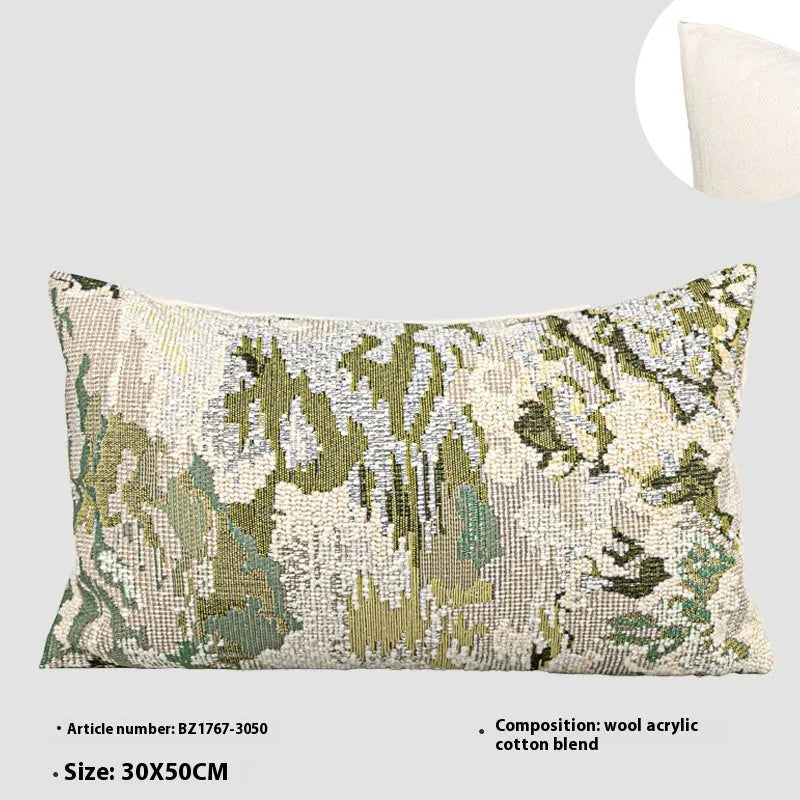 Green abstract floral pattern on a wool blend cushion cover, shown in square and lumbar pillow sizes.