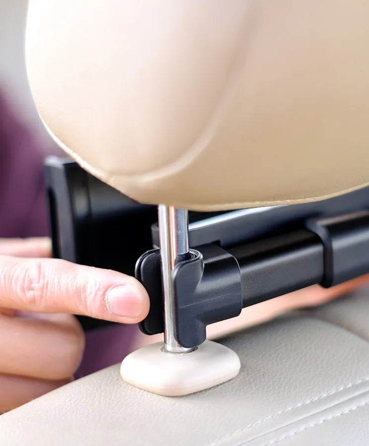 Black universal car phone and tablet holder with adjustable clamp mounted on vehicle rear seat