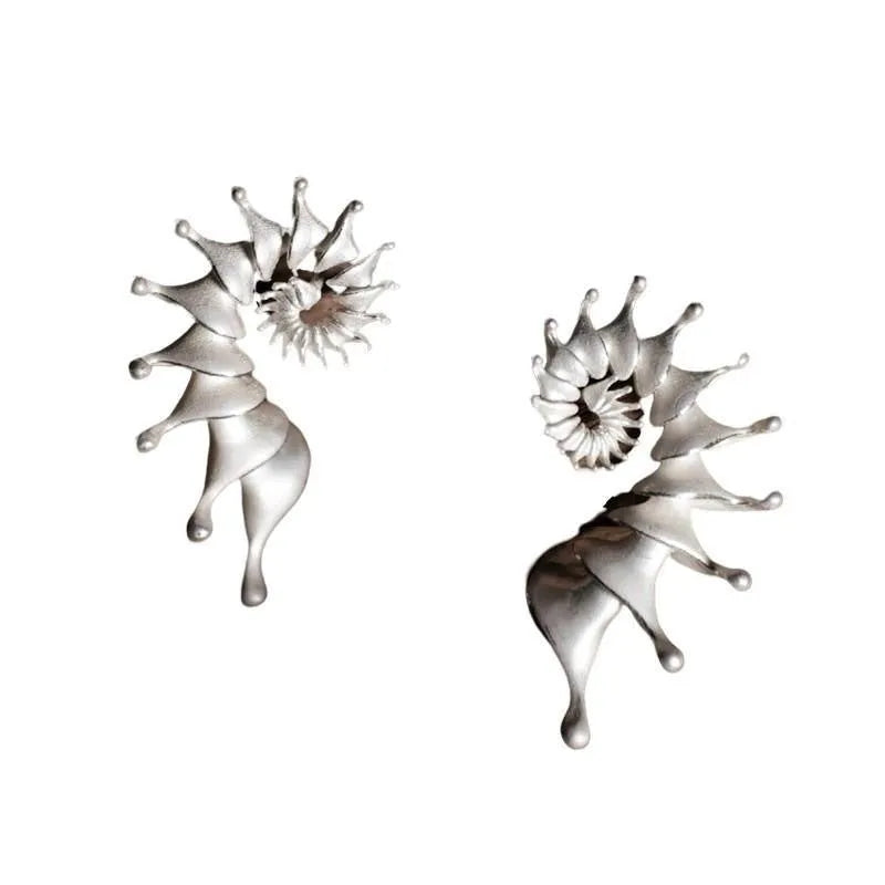 Conch colour stud earrings with three-dimensional matte finish and irregular contemporary design