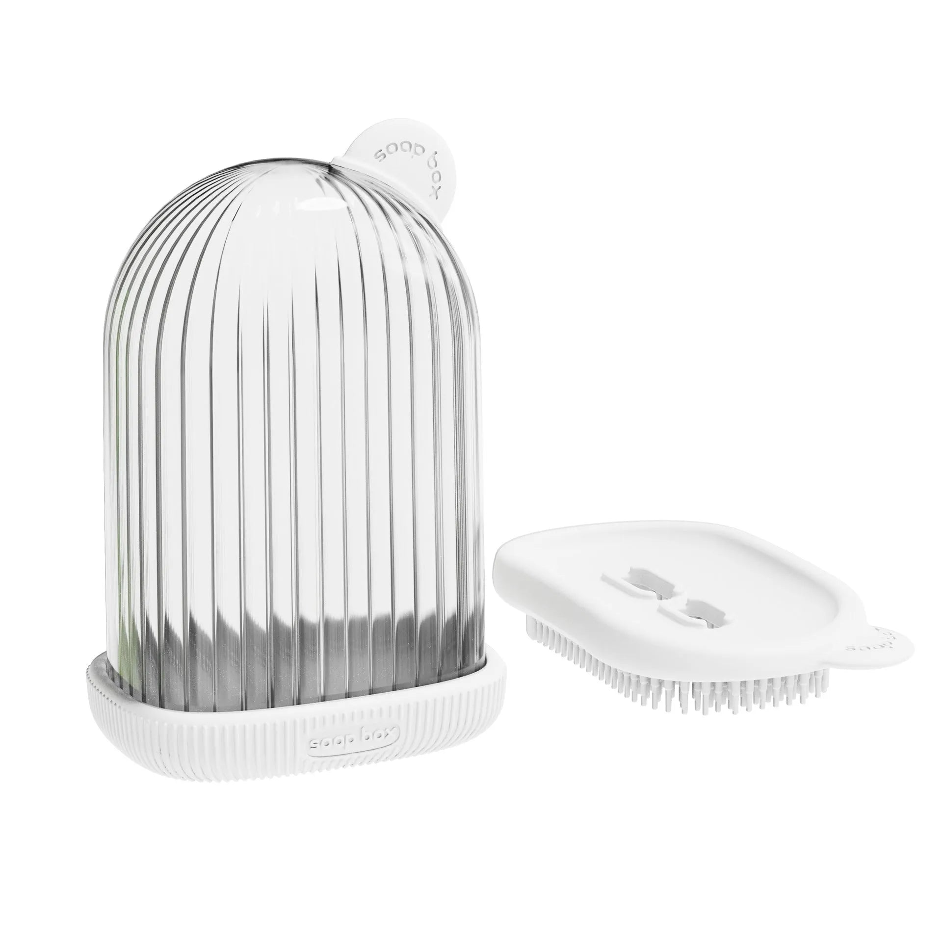Compact PET travel soap dish in cream white, with a bar of soap on top