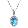 Women's 925 silver blue topaz jewellery set showing geometric earrings, ring, pendant and necklace.