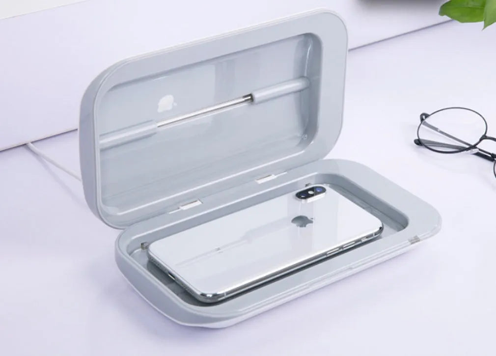 White double UV phone sterilizer box with two UV lamps inside, USB cable included