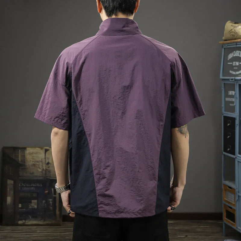 Brown men's casual half-zip short-sleeve shirt with a stand collar, showing the fleece-lined interior and loose fit.