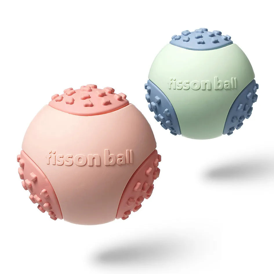 Green and pink rolling ball dog toy with 64mm diameter for small and medium dogs.