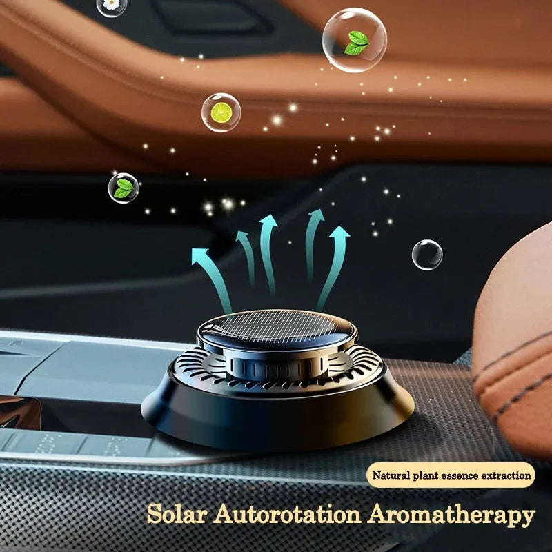 Solar-powered kinetic car air freshener with rotating double rings in black plastic with wood slice accents