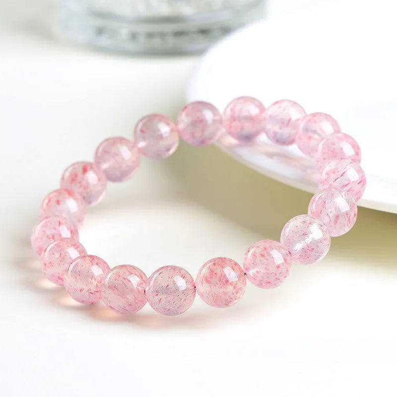 Natural white water strawberry quartz crystal bracelet with geometric beads.