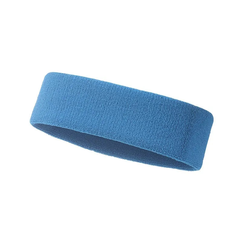 Elastic solid colour sports anti-sweat headband in blue on a white background.