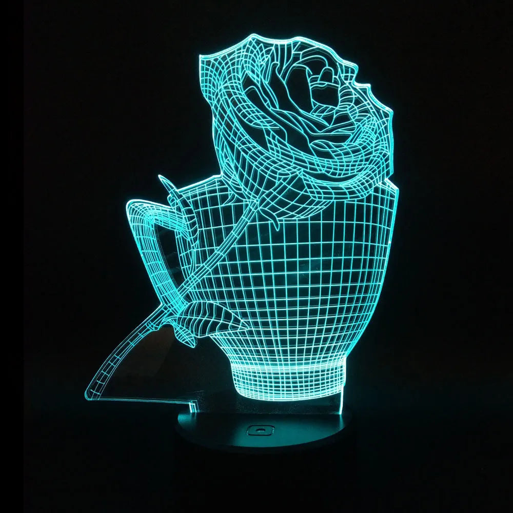 3D acrylic rose flower night light in black finish on a table, showing multicoloured LED illumination.