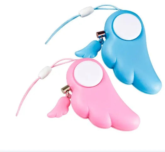 Blue personal security alarm with clip attached to a handbag strap, showing compact size and pull-rope mechanism