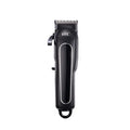 A black wireless hair clipper with four plastic limiting combs placed on a white background.