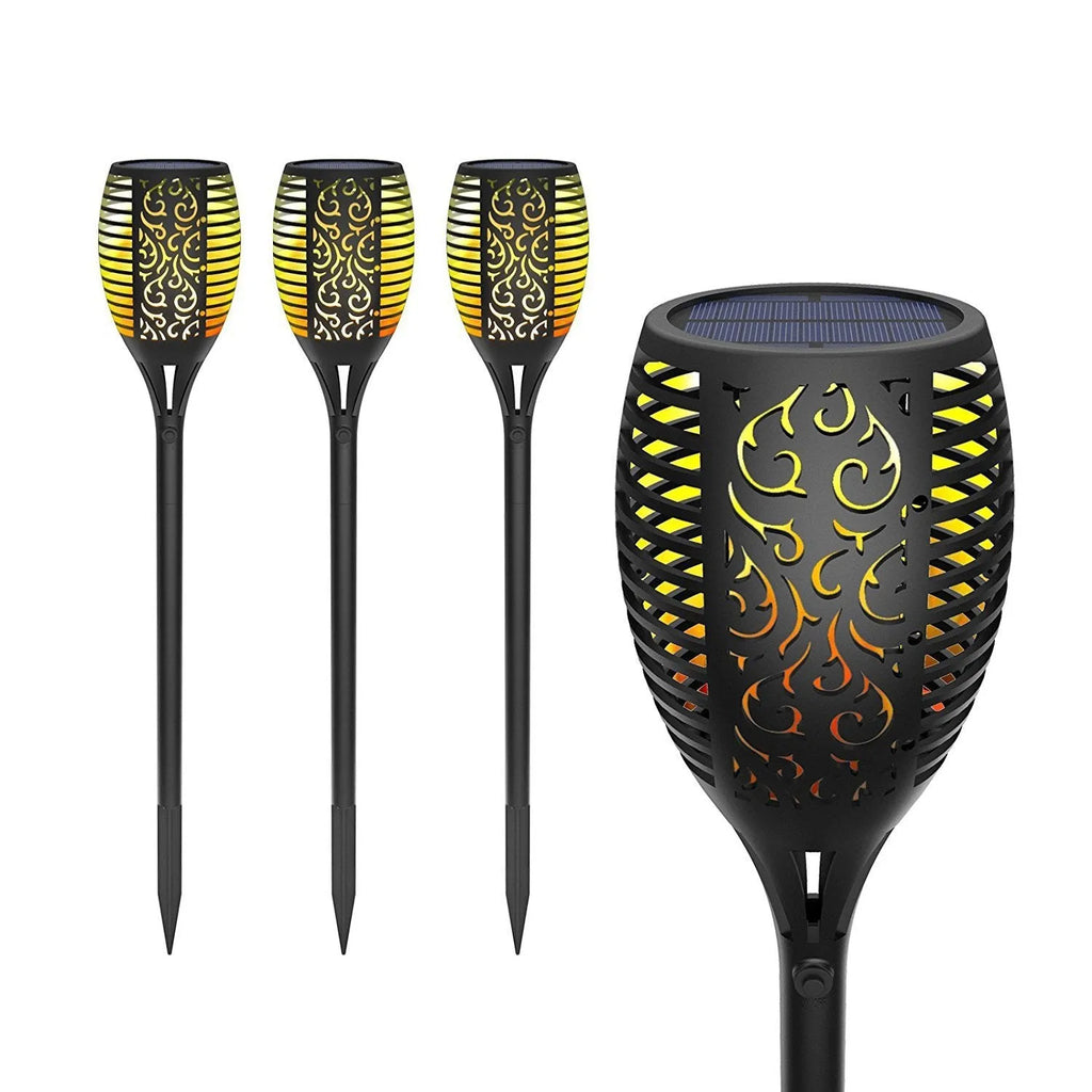 83cm tall black solar flame flickering lawn lamp with warm white LED dancing flame effect on grass