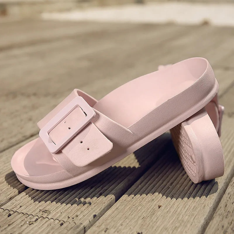 Women's grey blue EVA buckle slippers showing buckle detail and textured sole