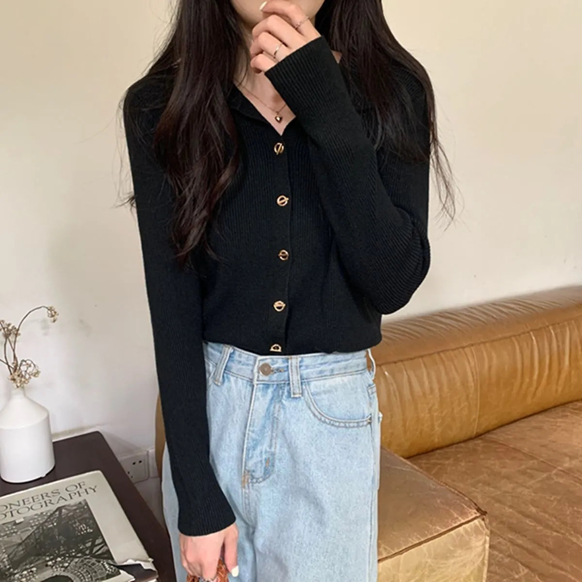 Loose fit knitted cardigan in beige, shown worn open as a long-sleeved top
