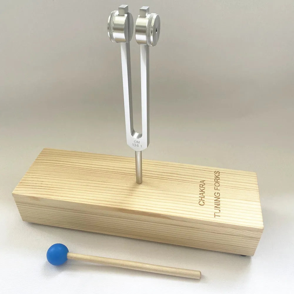 Aluminium alloy 432Hz tuning fork with acoustic speaker on kraft paper background