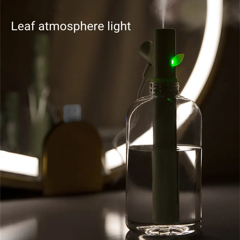 Transparent plastic USB humidifier with branch design and water visible inside