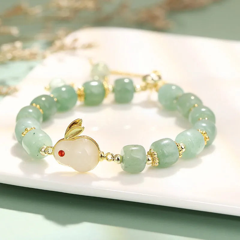 Green aventurine and strawberry quartz rabbit charm bracelet for women with copper and gold details