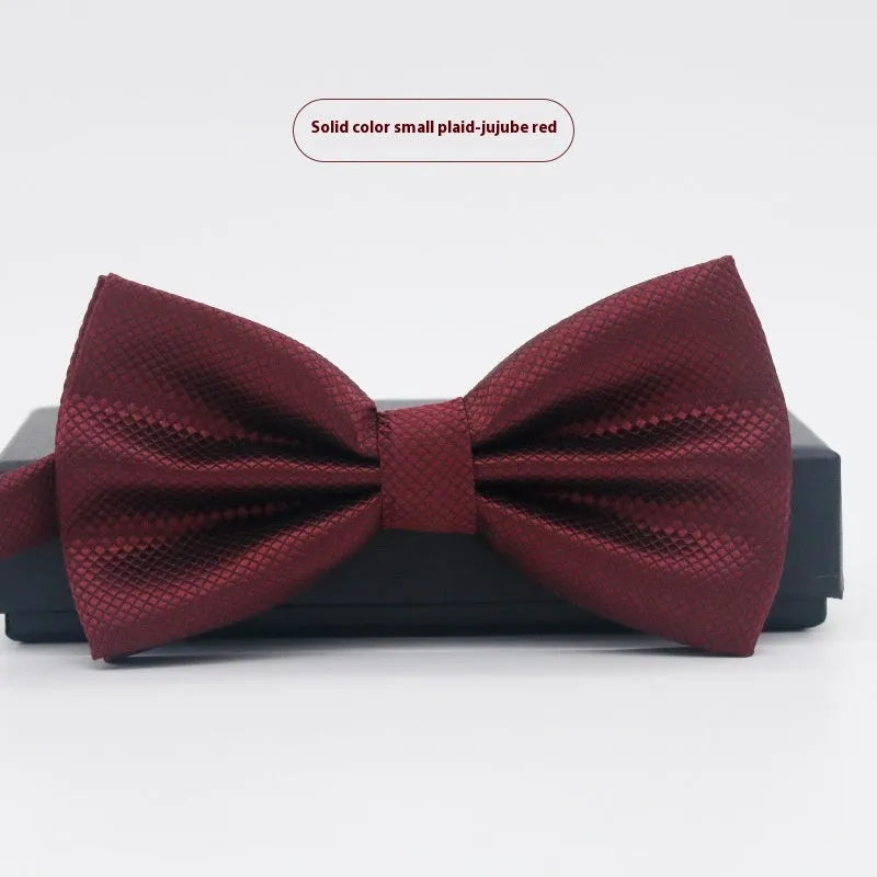 Solid colour flat head bow tie for formal wear in multiple colours including black, red, and blue.