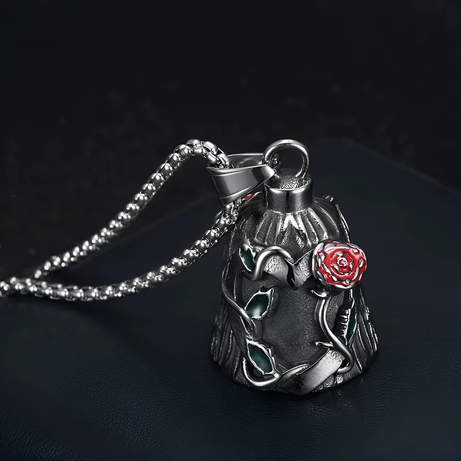 Polished titanium steel motorcycle lucky bell with a double-sided epoxy rose design in retro steel colour.