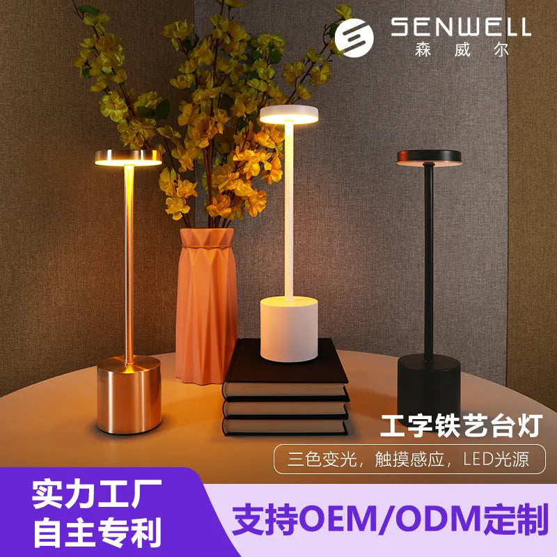 Modern minimalist iron LED table lamp with warm diffused glow, silver finish, I-shaped design