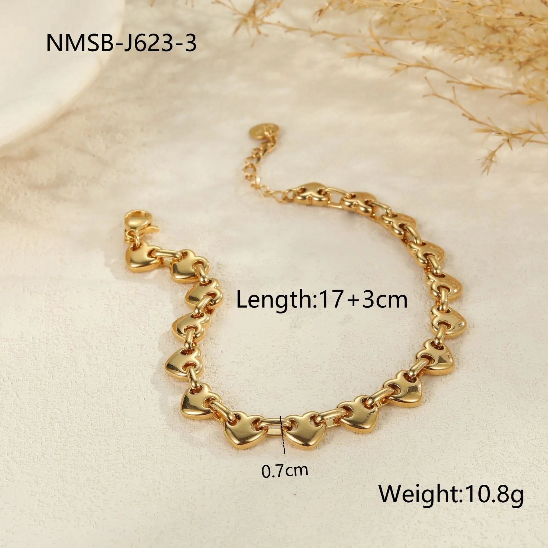 Stainless steel women's bracelet with a hollowed-out heart charm in gold or steel colour.