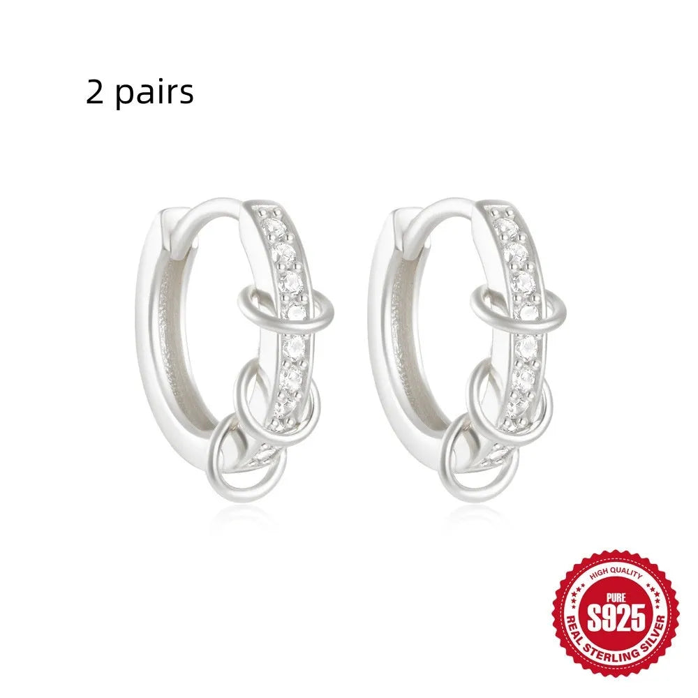 Sterling silver geometric stud earrings with round diamond accents in gold and silver electroplated finishes
