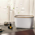 GX-22K white household atomizer humidifier and essential oil diffuser with night light on a wooden table.