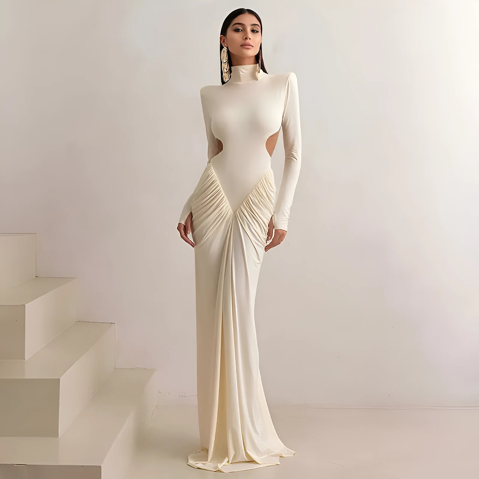 Women's slim fit long sleeve dress with high collar and pleated backless detail in light apricot colour