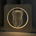 Wood colour plastic tooth shaped USB night lamp on a surface