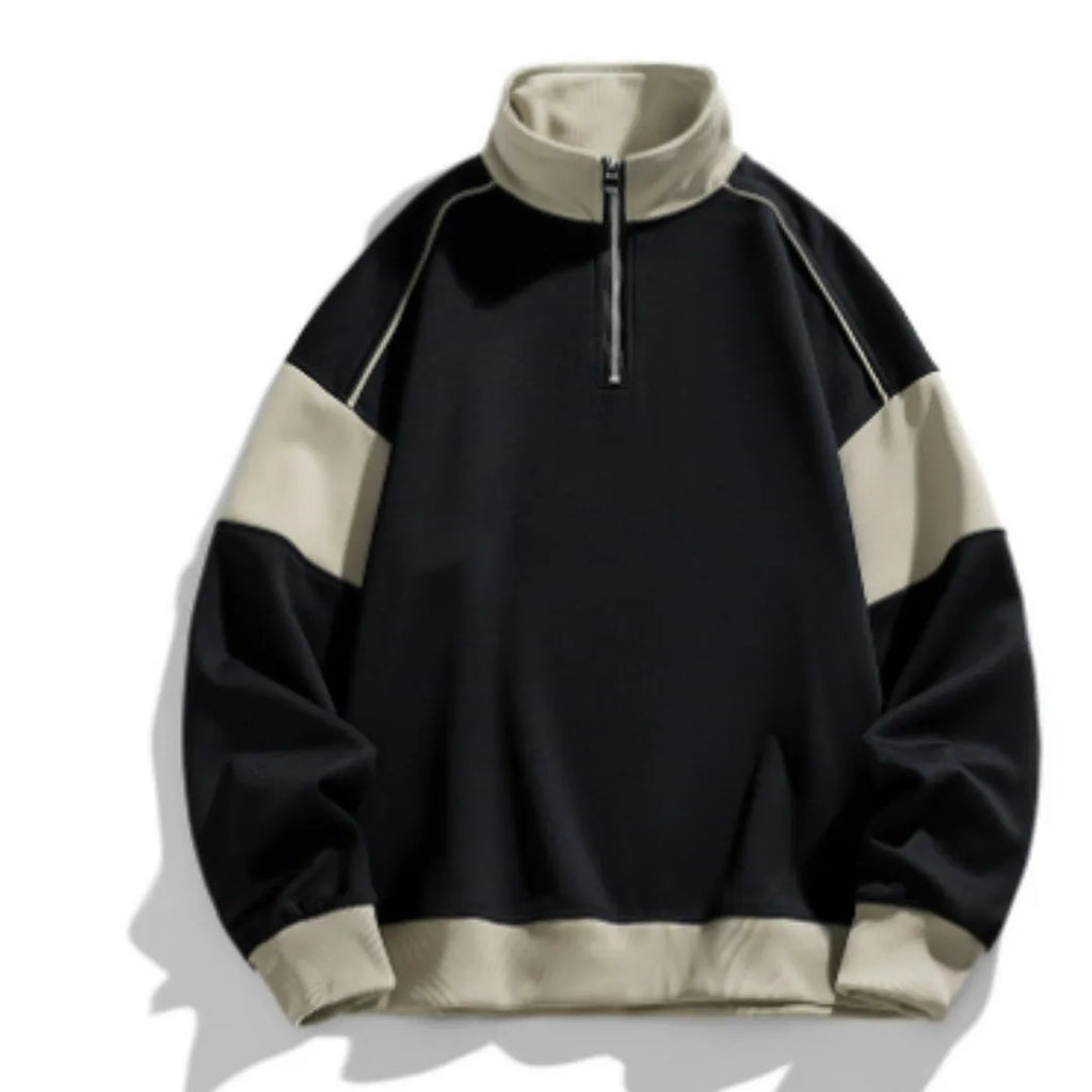 A man's thin corduroy hooded pullover sweater with drop shoulders and loose lapels, in a neutral colour.