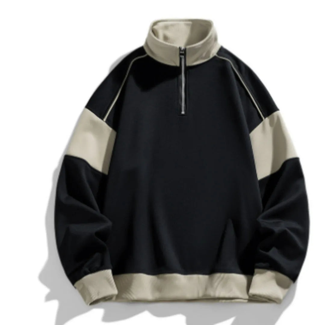 A man's thin corduroy hooded pullover sweater with drop shoulders and loose lapels, in a neutral colour.