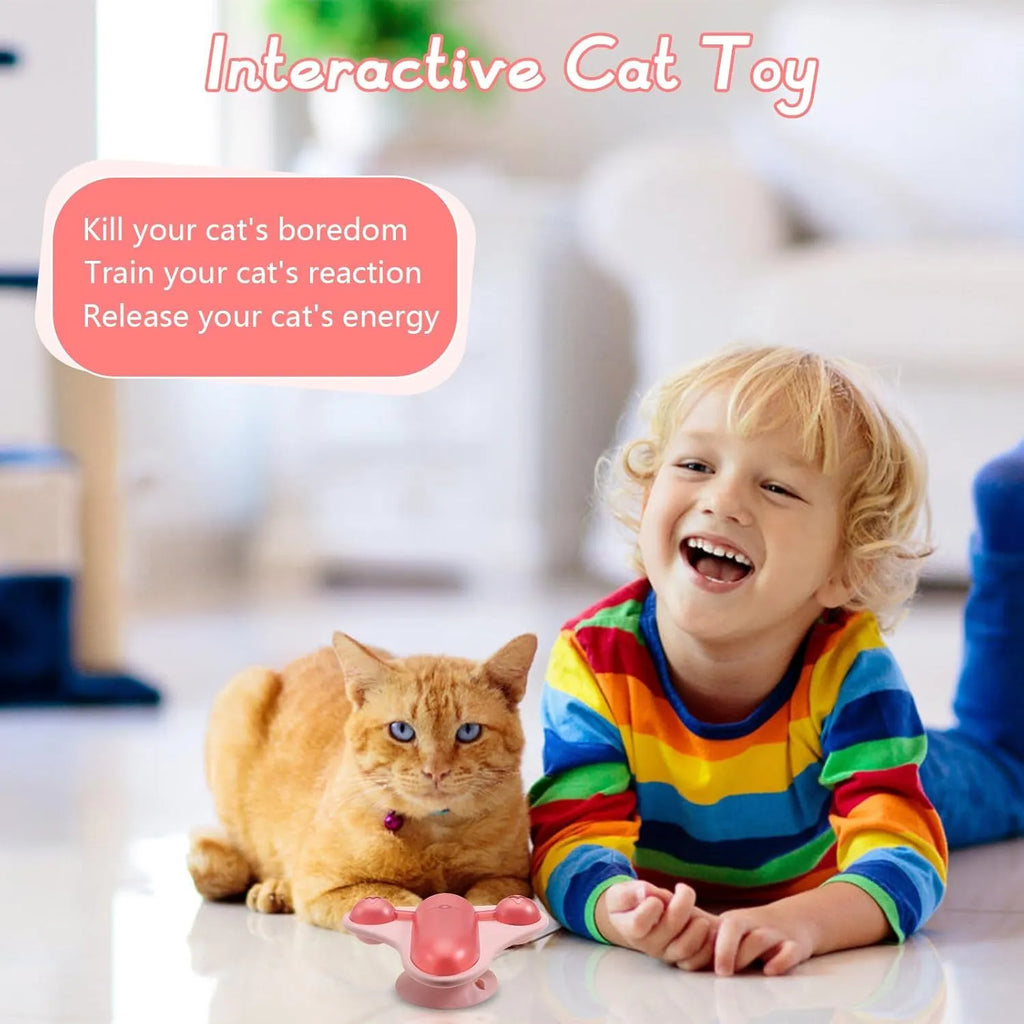 Blue interactive pet puzzle toy with bell, catnip, and clear snack cabin on a suction cup base.