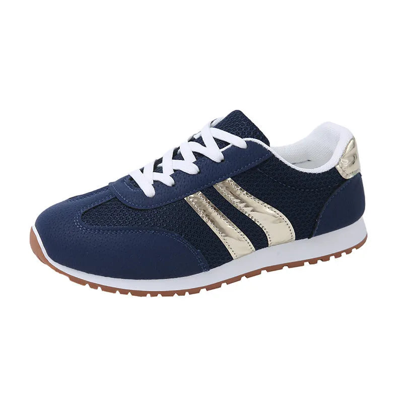 Blue women's sports shoes with cross shoulder straps, round toe, and flat rubber sole.