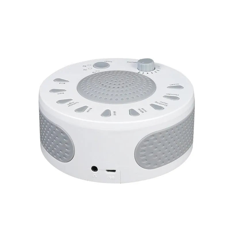 White portable white noise sleep sound machine with control knob on a bedside table.
