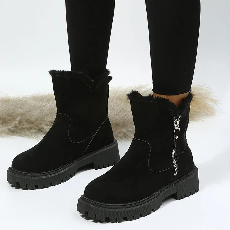 Women's black thick plush high top snow boots with side zipper and round toe on a rubber sole.