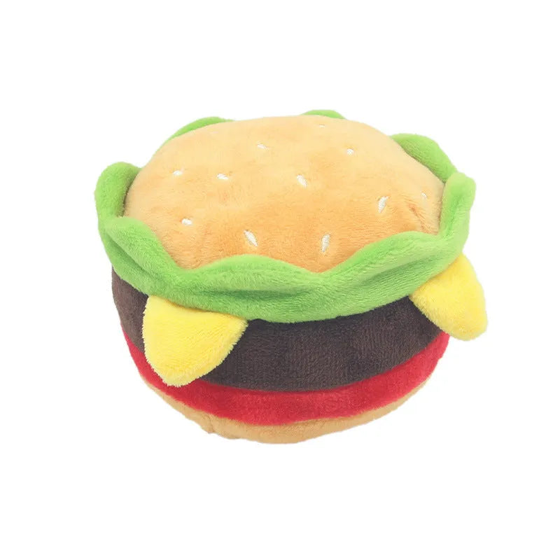 Set of three soft plush sounding toys in shapes of hamburger, french fries, and milkshake cup on a plain background