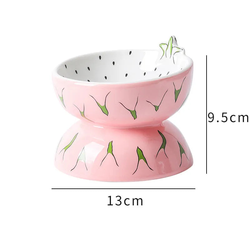 Ceramic raised cat bowl with tilted design in orange, pitaya or watermelon pattern.