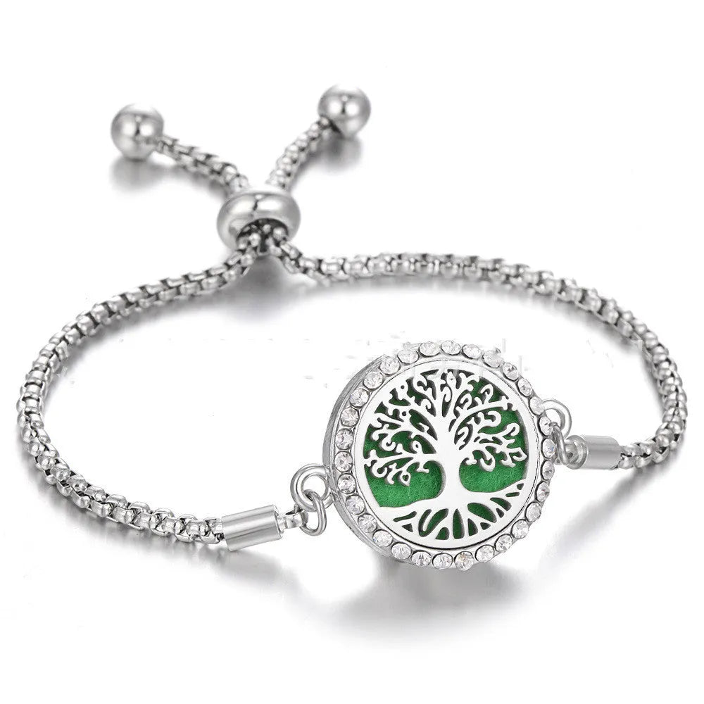 Hollow stainless steel adjustable aromatherapy bracelet with 20mm box diameter and electroplated alloy finish on white background