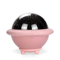 Pink UFO-shaped LED night light projecting a starry sky pattern on a wall.